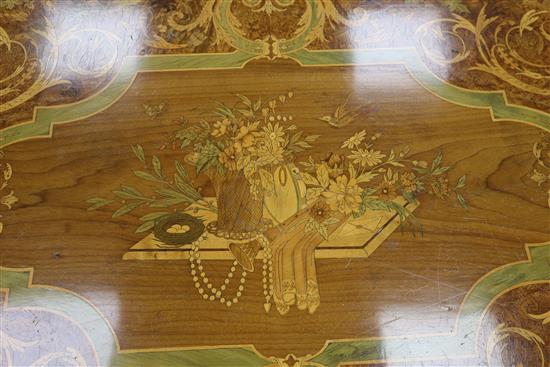 A Louis XVI style marquetry inlaid centre table, with shaped X stretcher W.127cm